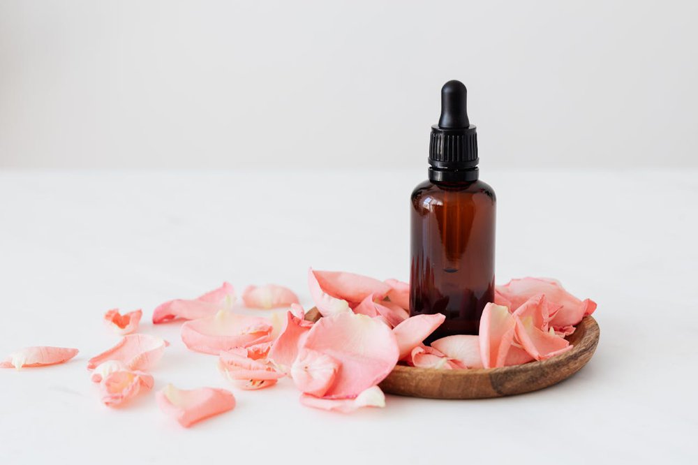 flat-lay-essential-oil-bottle-plain-background.jpg